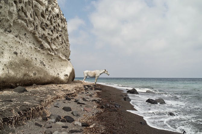 Photographer Petros Koublis describes the Santorini that he captures as the “equivalent of a dream”—which is exactly what it feels like to view his photographs—like looking through the lens of a dream.