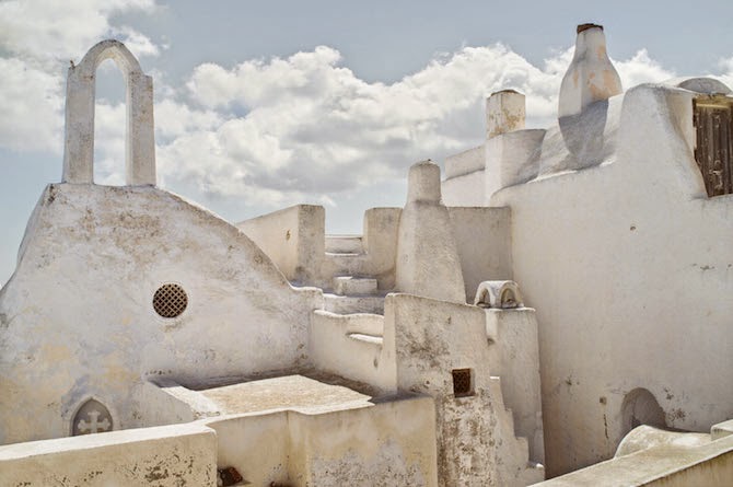 Photographer Petros Koublis describes the Santorini that he captures as the “equivalent of a dream”—which is exactly what it feels like to view his photographs—like looking through the lens of a dream.