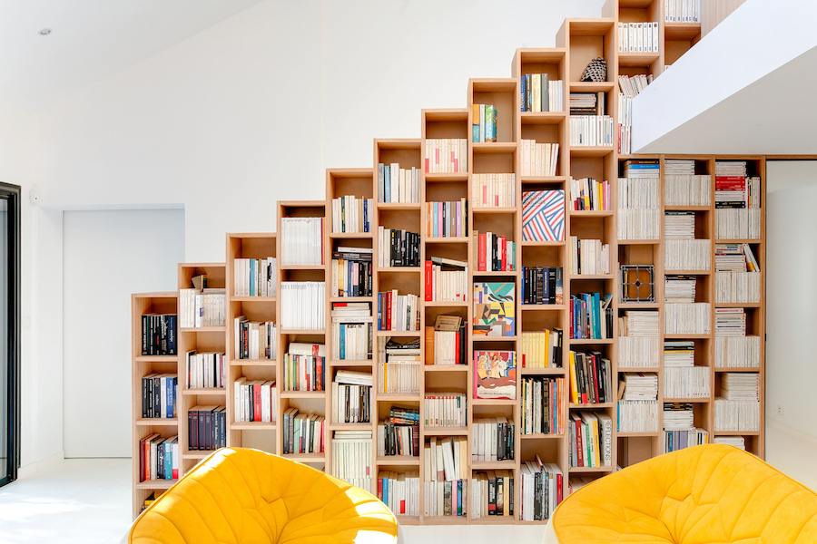 A Stunning, Bright Home in Paris by Andrea Mosca with a staircase bookshelf design