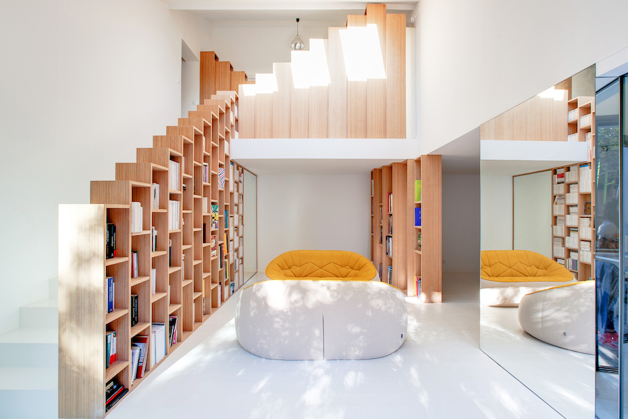 A Stunning, Bright Home in Paris by Andrea Mosca with a staircase bookshelf