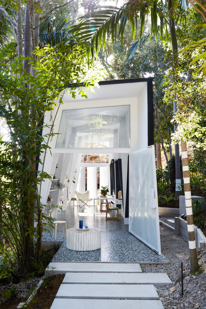 Inspired by the concept of a shack, Marc&Co created this studio office in a subtropical garden for interior styling firm Indigo Jungle.